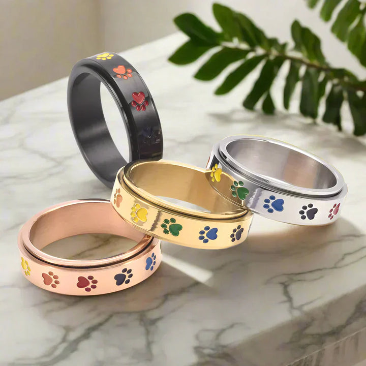 Thea - Anneau rotatif anti-stress avec pattes arc-en-ciel